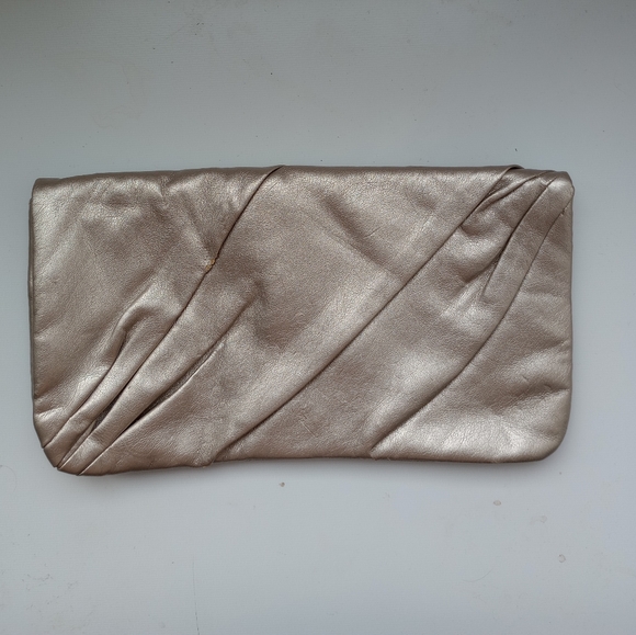 Swarovski Handbags - Swarovski Metallic PU Clutch